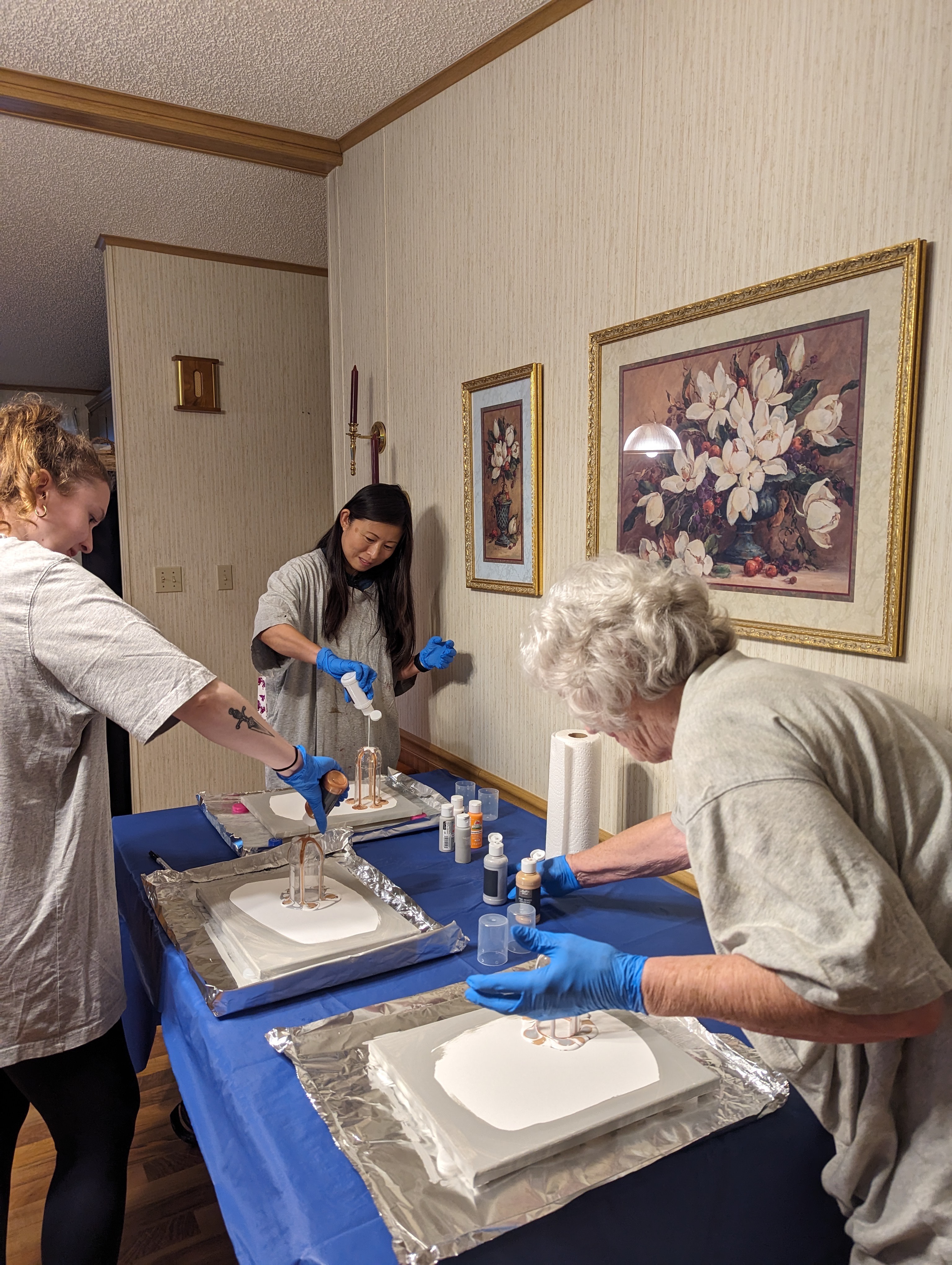 Everyone started to pour paint on the bottom of the carefully selected bottles by mom and dad